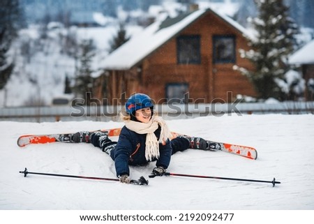 Little happy boy is learning to ski. Ski equipment, winter clothes. Active sports entertainment during the winter holidays.
