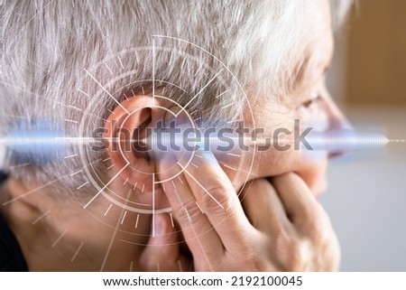 Hearing Aid And Painful Ear Ache. Hearing Issue Royalty-Free Stock Photo #2192100045