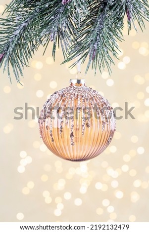 Christmas background, baubles and branch of spruce tree.