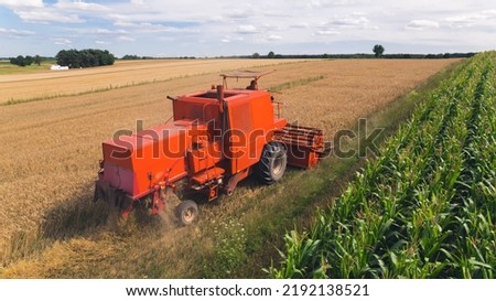 harvester harvesting on the wheat field. High quality photo