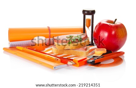 Writing materials, a paint, hourglasses, sandwich and apple on the striped napkin, isolated on white