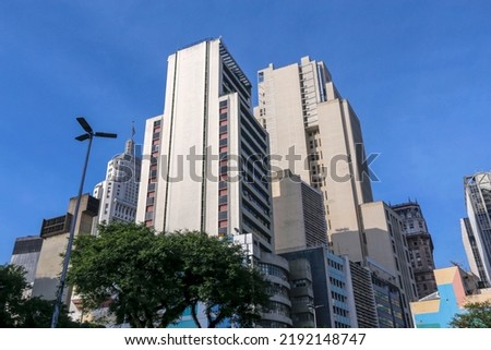 Cityscape: buildings in perspective, with wide angle lens under blue sky. Largo Sao Bento, Sao Paulo city, Brazil