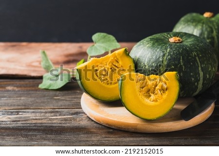 Green pumpkin on wooden background, Organic vegetable