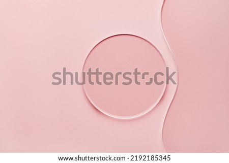 Empty round petri dish and wavy glass slide on pink background. Mockup for cosmetic or scientific product sample Royalty-Free Stock Photo #2192185345