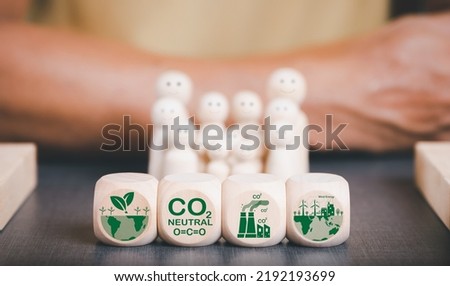 Industrial emissions pollute the environment and ecosystems. including climate change Carbon Renewable Energy Agreement reduce greenhouse gas emissions ,The wooden blocks are placed on the table. Royalty-Free Stock Photo #2192193699
