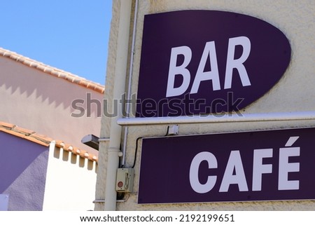 bar cafe french sign text on facade wall pub in city street storefront building coffee entrance