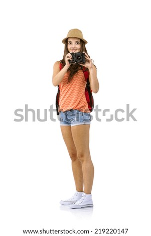 Young woman tourist taking picture, isolated on white
