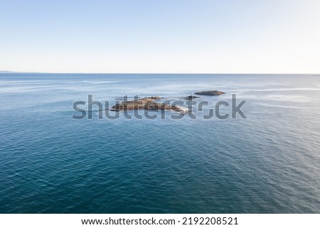 Aerial view over an archipelago in the Pacific Ocean off the coast of Queensland.