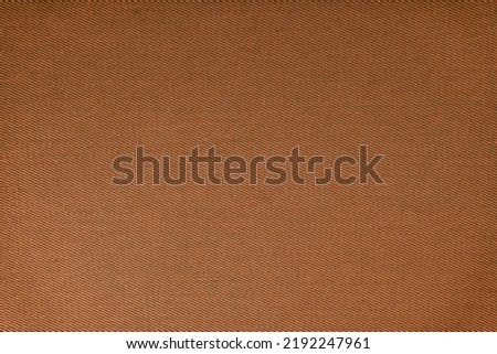 Texture of natural brown fabric or cloth. Fabric texture diagonal weave of natural cotton or linen textile material. Blue canvas background. Decorative fabric for curtain, furniture, walls, clothes Royalty-Free Stock Photo #2192247961