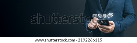 Customer support hotline Contact us people connection. Businessman using Smart Phone with email, call phone, address, Chat message. man using cellphone with email, call phone, mail, chat icons Royalty-Free Stock Photo #2192266115