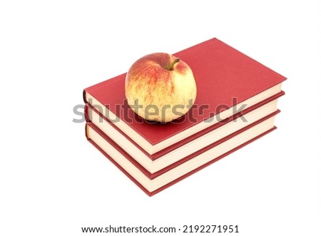 Apple on a Stack of Book isolated on white background
