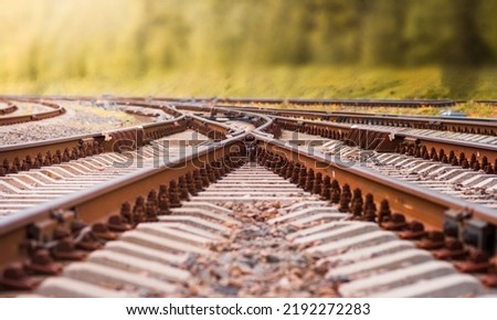 the railway leading to autumn. selective focus on rail crossing