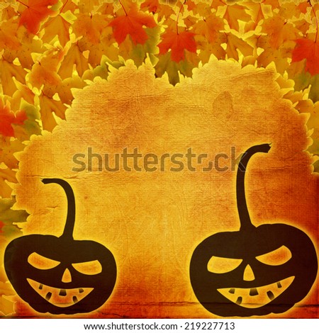 Festive pumpkin Halloween Day on the abstract paper background with autumn leaves