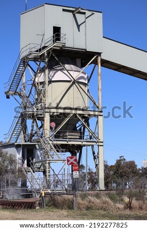 grain train loader at the end of a grain conveyer
 Royalty-Free Stock Photo #2192277825