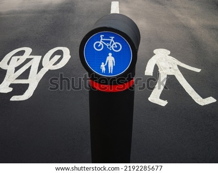 Road signboard and markings for pedestrians and cyclists outdoor