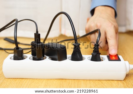energy savings with turning off electrical appliances Royalty-Free Stock Photo #219228961