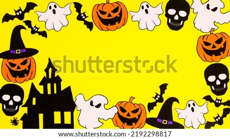 Creative Halloween frame made of various scary stickers on yellow background. Copy space flat lay