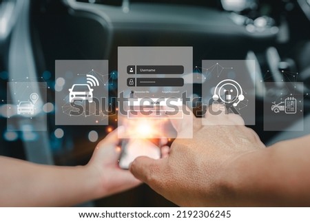 Car service and business on virtual screen concept, Hand a man use smartphone and log-in to the security system of the car, online find a car system with Real-time vehicle tracking technology Royalty-Free Stock Photo #2192306245