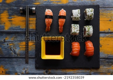 Japanese assorted sushi served on stone plate. Top view.
