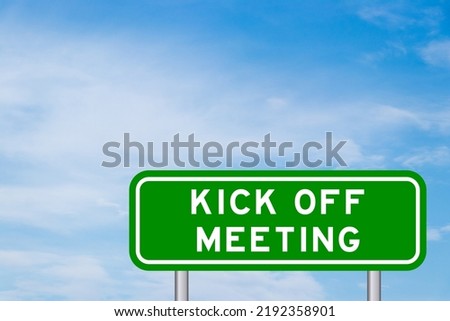 Green color transportation sign with word kick off meeting on blue sky with white cloud background Royalty-Free Stock Photo #2192358901