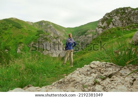 girl on the background of mountains landscape