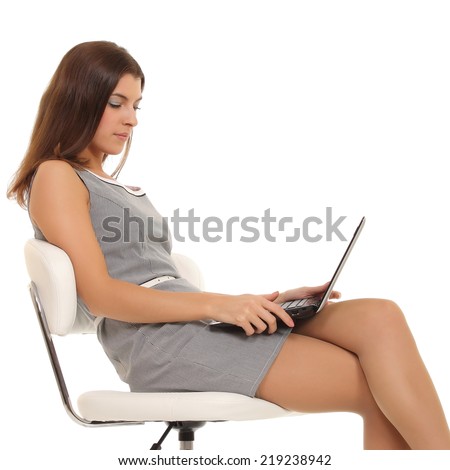 Girl working at the laptop.
