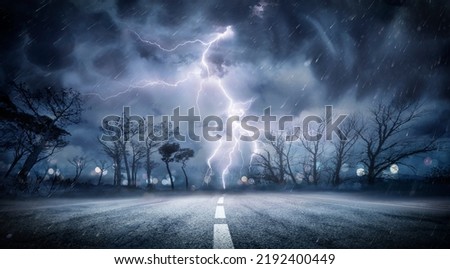 Lightning Thunderstorm Flash In The Storm On Road - Weather Concept Royalty-Free Stock Photo #2192400449