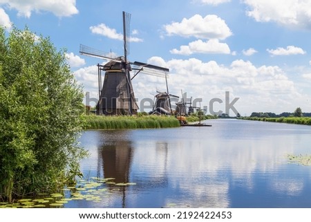 Windmills in a row in the UNESCO site of Kinderdijk in the Netherlands.