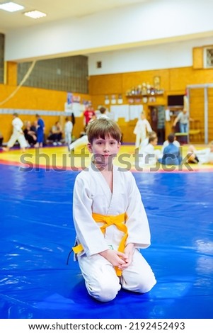 Judo - wrestling, tatami for wrestling, children of sports, legs on a bright colored tatami, selective focus