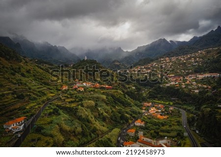 Sao Vicente or San Vicente, Madeira, Portugal - October 2021: The fragment view of Sao Vicente village from mountain. Catholic church on front. Aerial drone picture