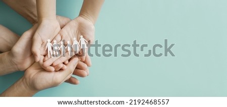 Hands holding multi generation family paper, family wellness, health insurance concept Royalty-Free Stock Photo #2192468557