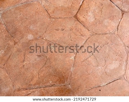 Orange stamp concrete floor texture background 