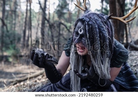 Forest witch in a pine forest