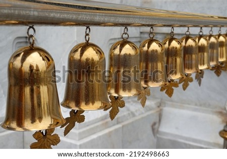 Many golden bells with ringing of the bells in the temple of thailand                               
