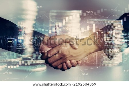 Business handshake on finance prosperity and money technology asset background . Economy and financial growth by investment in valuable stock market to gain wealth profit form currency trading Royalty-Free Stock Photo #2192504359