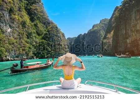 Woman tourist on boat trip, happy traveller relaxing at Pileh lagoon on Phi Phi island, Krabi, Thailand. Exotic landmark, destination Southeast Asia Travel, vacation and holiday concept Royalty-Free Stock Photo #2192515213