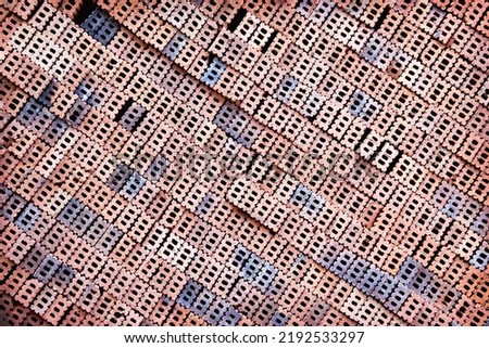 Bricks pile with diagonal seamless overlap patterns in construction site	background