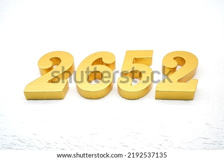   Number 2652 is made of gold painted teak, 1 cm thick, laid on a white painted aerated brick floor, visualized in 3D.                                                 