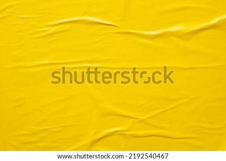 yellow crumpled and creased paper poster texture background