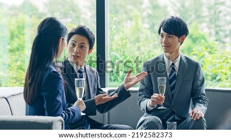 Group of businessperson talking in the office. Royalty-Free Stock Photo #2192582373