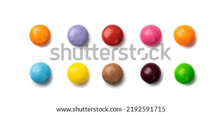 Small candies set isolated. Colorful dragees mix, multicolored glazed chocolate buttons, various dragee collection, rainbow candies on white background Royalty-Free Stock Photo #2192591715
