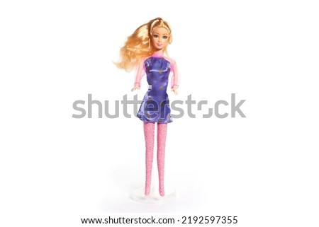 Plastic doll toy isolated on white background. High quality photo Royalty-Free Stock Photo #2192597355