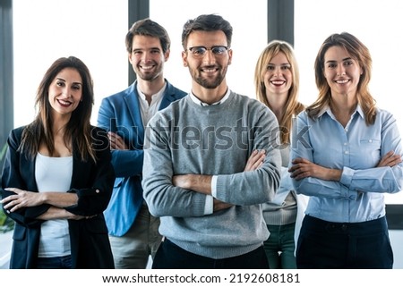 Shot of successful business multiage team posing and looking at camera in modern startup. Royalty-Free Stock Photo #2192608181