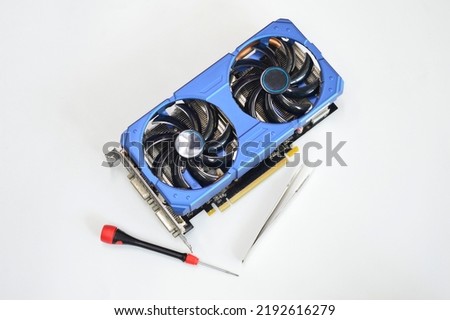 blue graphics card placed on a white background