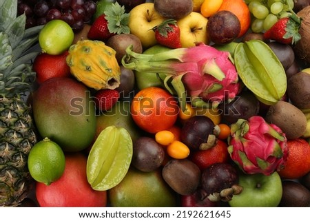 Assortment of fresh exotic fruits as background, top view Royalty-Free Stock Photo #2192621645