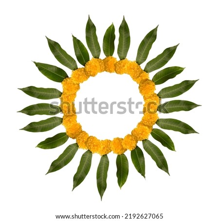 Round border with blank space made with marigild flowers and mango leaves. Hindu religious objects and elements for auspicious evenets, Diwali and wedding ceremony etc.   Royalty-Free Stock Photo #2192627065