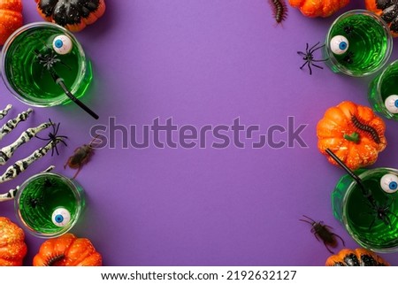 Halloween night concept. Top view photo of glasses with green floating eyes punch spiders pumpkins skeleton hand spooky insects centipedes and cockroaches on isolated violet background with copyspace