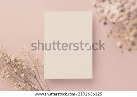 White book blank cover mockup on a beige background with dry flower, flat lay, mockup
 Royalty-Free Stock Photo #2192636125