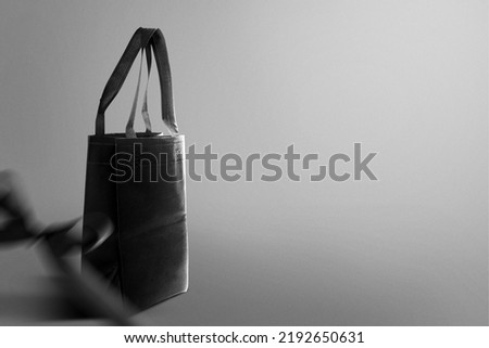 Shopping bag with a black background. Black Friday concept