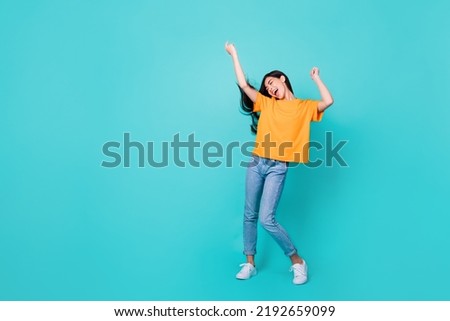 Full body photo of nice brunette lady dance wear t-shirt jeans shoes isolated on teal color background